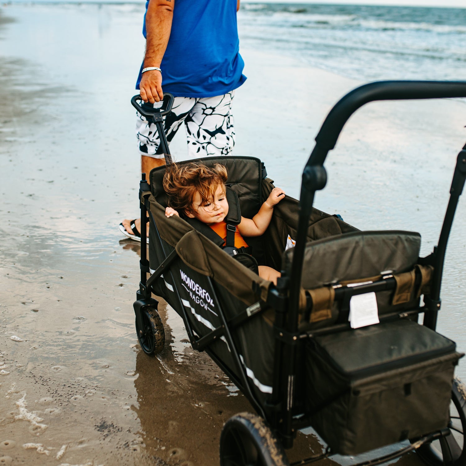 X2 Push + Pull Double Stroller Wagon w Magnetic Seatbelt Harness - Lifestyle Image - Wet Beach - Pulling